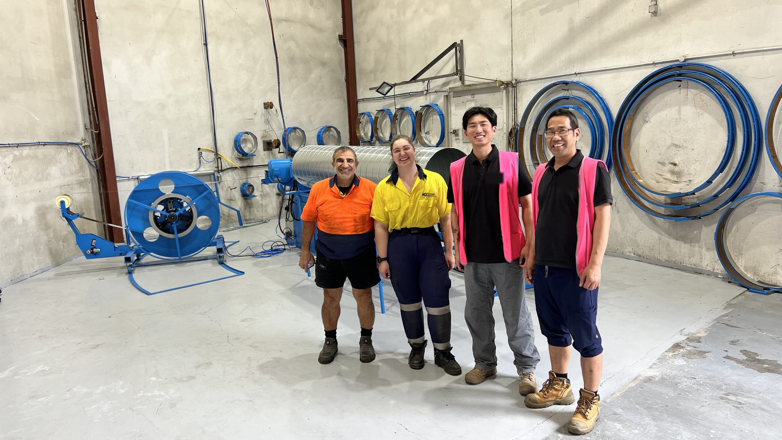 Kavanagh Industries and Taokron crew in front of the new SBTF-1602 spiral tubeformer in Smithfield, Sydney